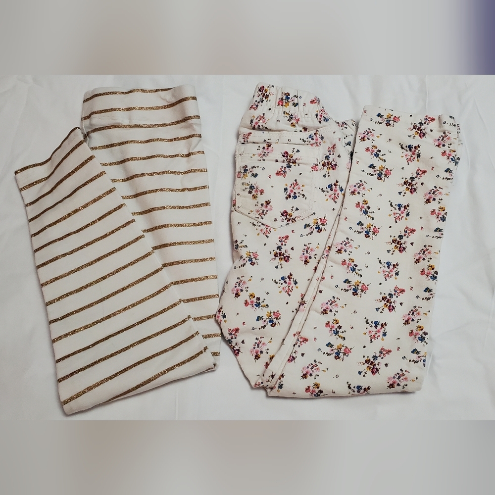 Set of 2 little girls pants. Cream/gold and Cream/multi floral. Size 5